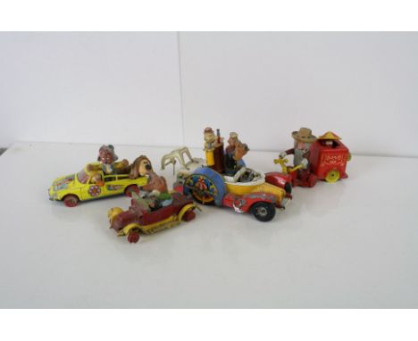 Four play worn Corgi diecast models to include 2 x Magic Roundabout, Popeye and Basil Brush 