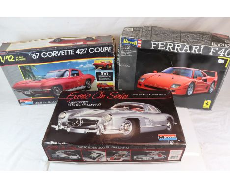 A collection of three 1/12th scale boxed model car kits to include a Ferrari F40 by Revell, a Mercedes 300SL gullwing by Mono