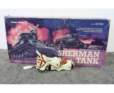 Boxed 60-3098 Radio Shack Radio Controlled Sherman Tank with controller and instructions, tatty box, plus a metal Muffin the 