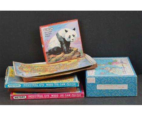 A collection of five vintage jigsaws to include the Victory Geographical wood jigsaw puzzle and the Victory England &amp; Wal