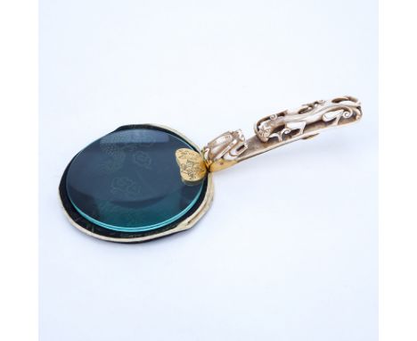 Early 20th Century Chinese Magnifying Glass with Carved Bone and Brass Belt Buckle Handle. Unmarked. Good condition. Measures
