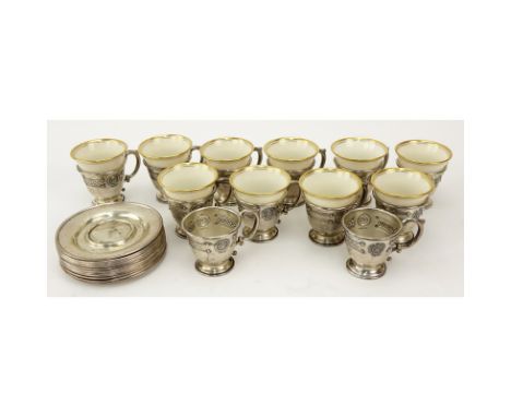 Set of Sterling and Porcelain Demitasse Cups and Saucers. Lot includes 10 Lenox porcelain cups, 12 Sterling cup holders, 12 s