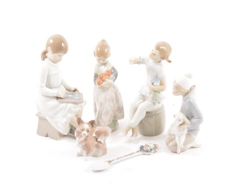 Four Lladro figures, children and a small dog, an unmarked spoon.