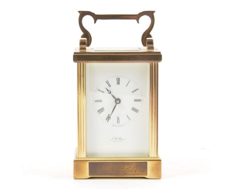 A brass cased carriage clock, rectangular enamelled dial, with Roman numerals, signed J W Benson, London, the case with engra