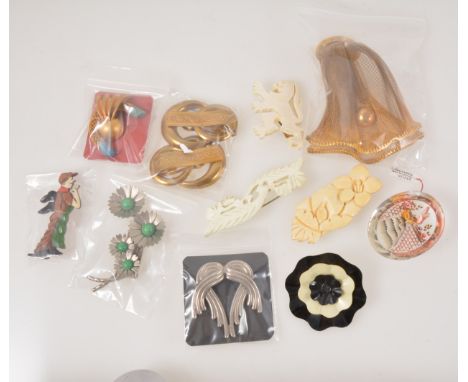 Thirty-six vintage brooches and clips from the 1930's-1950's, celluloid floral designs, a large 10cm gilt metal mesh clip, a 