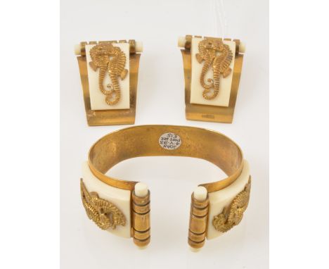 A 1930s Art Deco Hippocampe demi-parure retailed by JHP of Paris, and designed by Genevieve Hamon, comprising an open bangle 