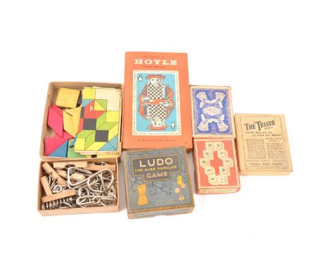 A box of vintage games; including puzzles, Dominoes, playing cards, Ludo, etc