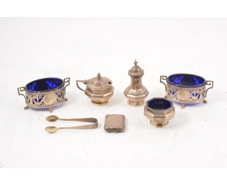 Pair of Continental silver salts, import marks, oval form with pierced and embossed portrait sides, blue glass liners, 10cm, 