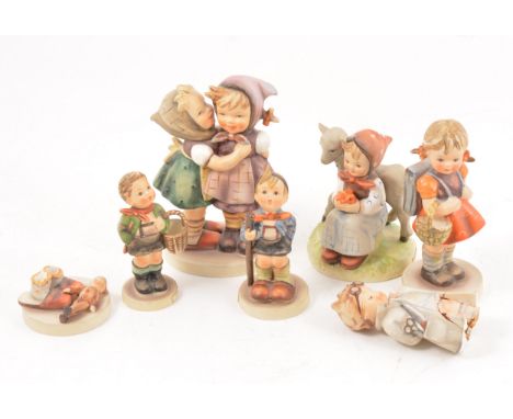 Hummel pottery group, Telling Her Secret, 14cm, and five other Hummel figurines, (6).