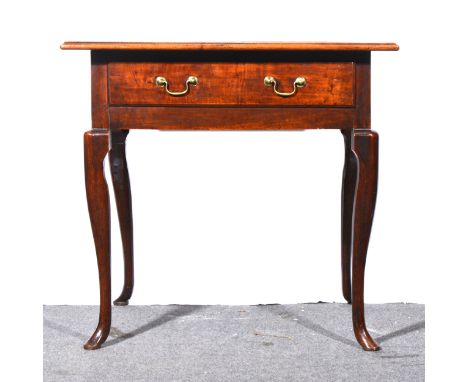 A Georgian fruitwood side table, rectangular top with a moulded edge, frieze drawer with replaced handles, cabriole legs, wid