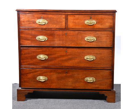 A Victorian mahogany chest of drawers, rectangular top with a moulded edge, two short and three long graduating drawers with 