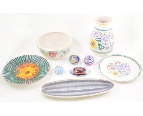 Poole pottery pear shape vase, floral decoration, 26cm, and a similar fruit bowl, two Poole plates, Poole bowl, a biscuit box