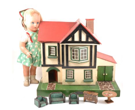 An Amersham Toys wooden dolls house, c1940s, painted exterior, fitted electric lighting, selection of furniture, along with a