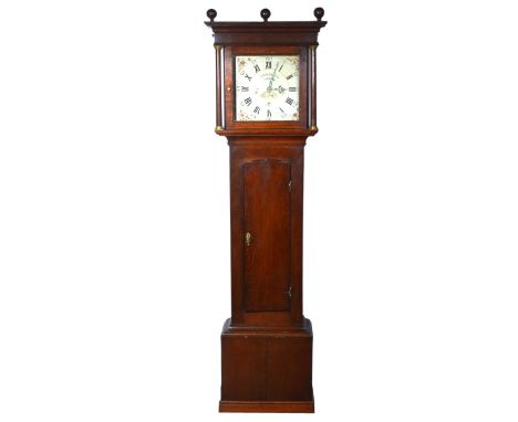 Oak longcase clock signed, cavetto cornice with three sphere finials, the hood with turned supports, long door, plinth base, 