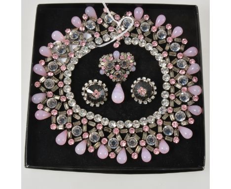 A vintage pink and clear crystal parure of a necklace, brooch and earrings, the brilliant and baguette cut stones in the 40mm