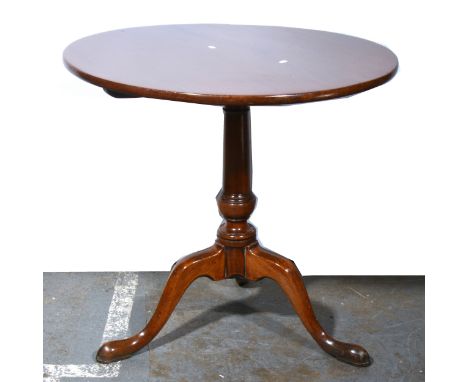 A Georgian mahogany tripod table, circular tilt top, turned column, splayed legs, diameter 76cm, height 73cm.