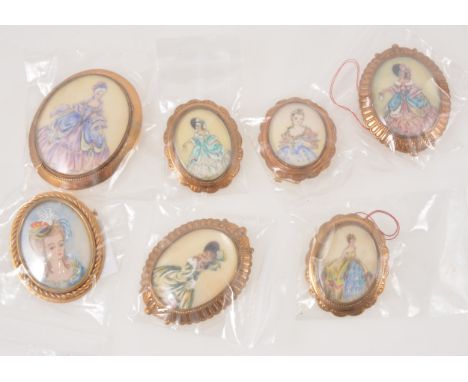Thomas L Mott - seven hand painted oval portrait brooches of ladies in crinoline costumes in gold-plated closed back mounts, 