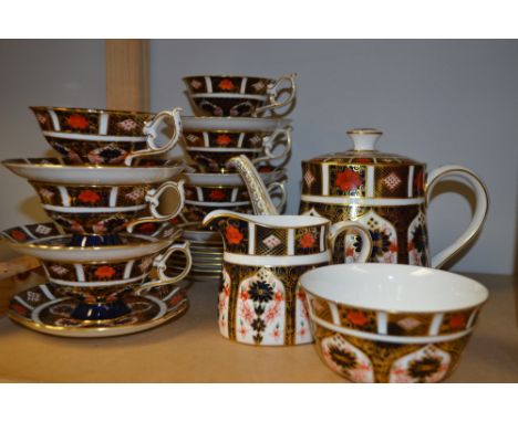 A Royal Crown Derby 1128 tea service for six inc, cups, saucers, side plates, tea pot, milk and sugar