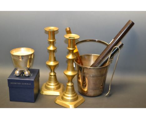 A pair of  Victorian brass ejector candlesticks; an EPNS ice bucket and drainer, a pair of claw tongs ensuite; a Price's mile