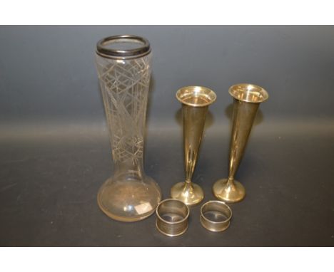 A pair of Edwardian silver specimen vases, Birmingham 1901; a George V silver napkin ring, engine turned, Birmingham 1913; an