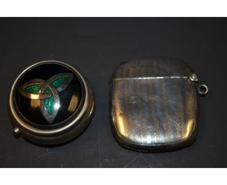 A George VI vesta case, engine turned, Birmingham 1945; a white metal and enamel pill box (2)