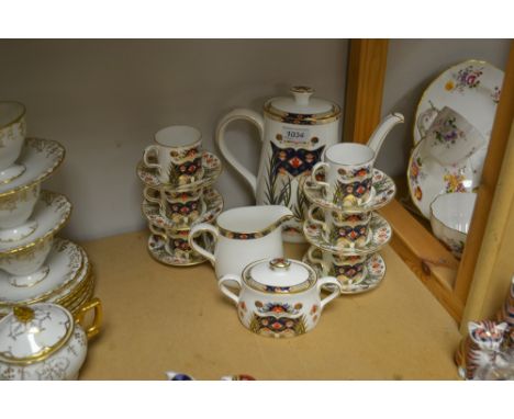 A Royal Crown Derby Rutland coffee service, comprising coffee pot, six coffee cans and saucers, milk jug, sugar and cover, al