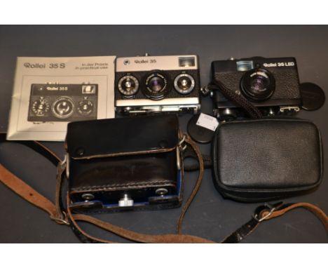 A Rollei 35, made in Germany, with Tesser lense and everyday case; another Rollei 35, made in Singapore; a Rollei 35 manual (