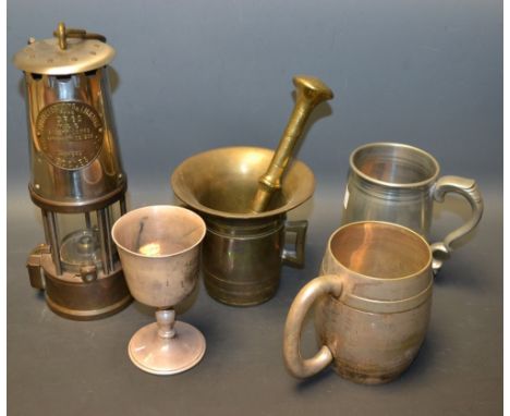 A projector lamp and lighting company type GR65 colliery lamp; a pestle and mortar; a silver plated tankard; etc.