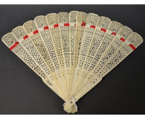 A Cantonese bone brisé thirteen fold fan, the sticks pierced with decorative motifs, strung with red silk, 25.8cm long, c. 18