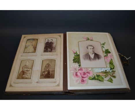 A Victorian tooled black leather photograph album containing assorted portrait  photographs including hand coloured examples 