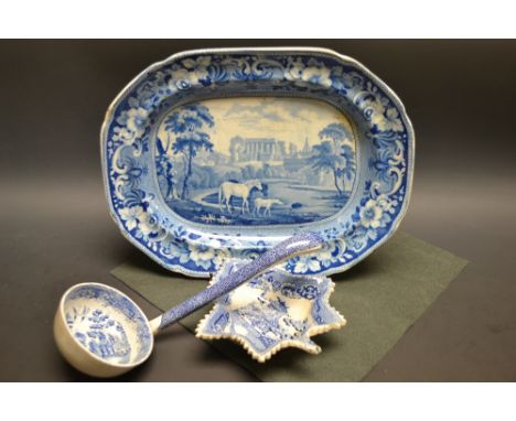 An early 19th century meat plate, transfer printed with a named view of Malmesbury Abbey, Wiltshire; pickle dish;  ladle (3)