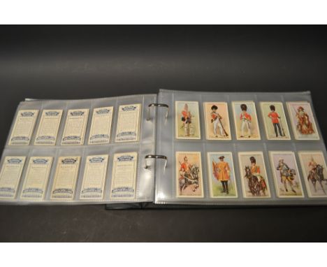 Cigarette Cards - an album of military themed sets, includes Wills Allied Army leaders, Players Military head dress, regiment