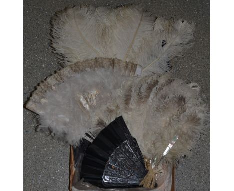 Fans - an Edwardian Ostrich feather fan, seventeen inlaid mother of pearl blades;  a Victorian ebonised and carved blade blac