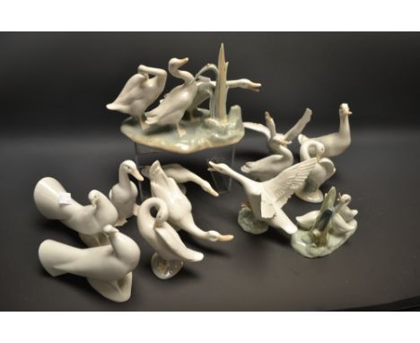 A Lladro model of three geese; another, goose about to take flight; other, similar; a pair of Nao doves; others 
