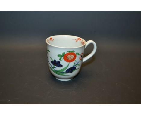 A Worcester coffee cup, painted in the Imari palette with stylised flowerheads and blossoming prunus,  notched handle,  pseud