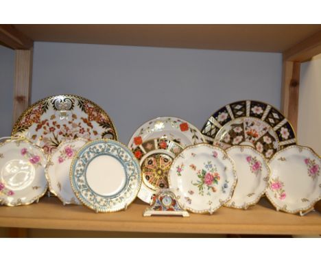 Royal Crown Derby - an 1128 Imari side plate, 16cm diam, first quality; an Arita miniature mantel clock, second quality; an I