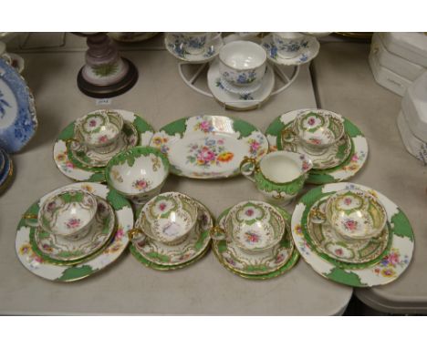 A Royal Crown Derby six-setting tea service, decorated with floral boquets, comprising cups, saucers and sideplates, milk and