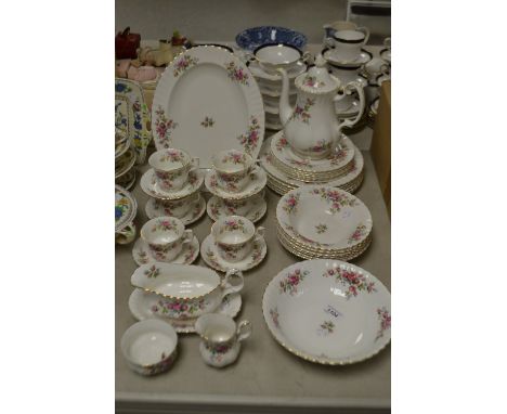 A Royal Albert Moss Rose pattern tea and dinner set, comprising coffee pot, milk and sugar, six cups, saucers and tea plates;