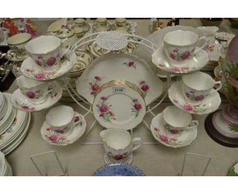 A Royal Albert part tea service, friendship series of 12, Carnation, comprising biscuit plate, cream jug, six side plates, si