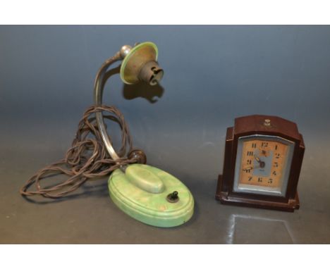 An Art Deco Bakelite mantel clock, alarm mechanism, c.1940; a green Bakelite desk lamp (2)  