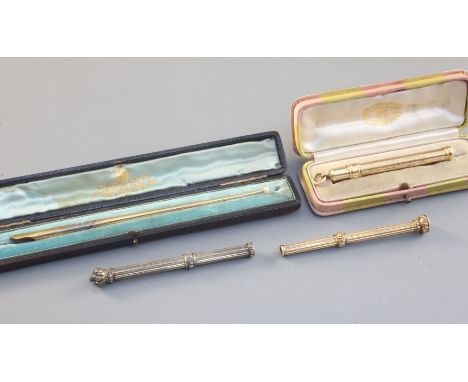 Four gold pencil holders, English and French, late 19th - 20th century, comprising two examples, English c.1840, with flutes 