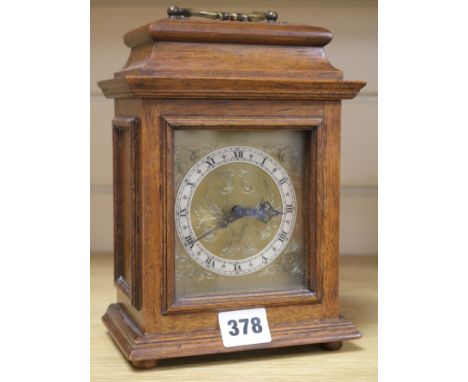 An oak mantel clock 8.5ins