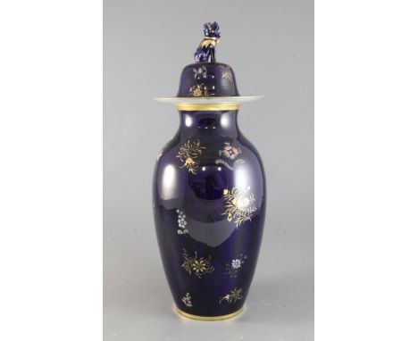 A Spode stone china blue ground ovoid vase and cover, c.1830, with mythical beast finial, gilt and enamelled with scattered s