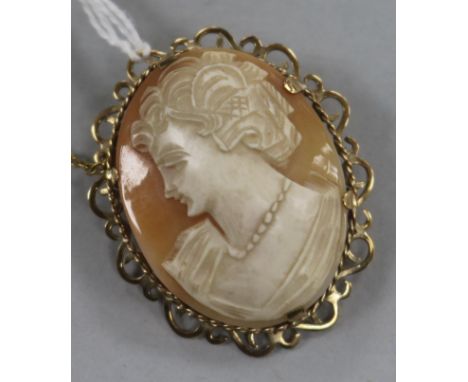 A 9ct gold-mounted cameo brooch with safety chain by EJCY & Co