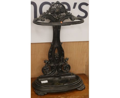 A Victorian black painted cast iron stick stand, W.42cm