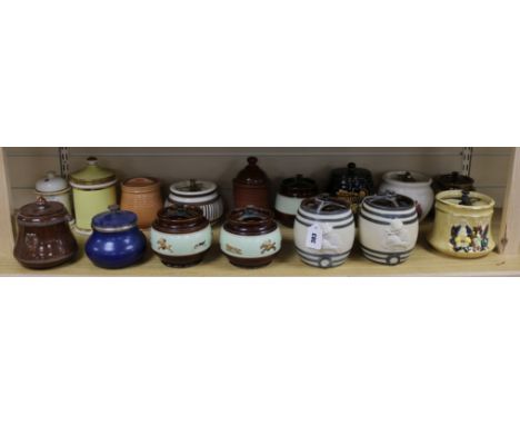 A Royal Winton tobacco jar with moulded decoration and fifteen other tobacco jars, some decorated with hunting scenes (16)