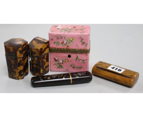 Two tortoiseshell etuis, a tortoiseshell case, a 19th century walnut snuff box and and enamel porcelain etui
