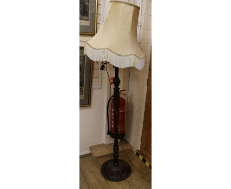 A turned and fluted lamp standard and shade Width of base 35cm