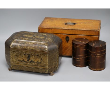 A 19th century Chinese lacquer tea caddy, a satinwood tea caddy and two lacquer canisters