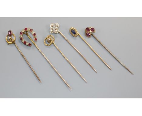 Six assorted mainly early 20th century yellow metal and gem set stick pins, including diamond set and one stamped 9ct.